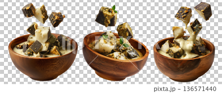 Steamed taro and rice cakes with coconut sauce, scallions, and peanuts in wooden bowl, isolated on white background Steamed taro and rice cakes with coconut sauce, scallions, and peanuts in wooden bowl, isolated on white background 136571440