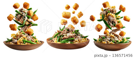 Bowls of green beans, crispy tater tots, and creamy tuna noodle casserole on wooden plate, isolated on white background 136571456
