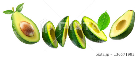 Whole and halved ripe avocados with green leaves, isolated on white background. Concept of fresh organic tropical fruit 136571993