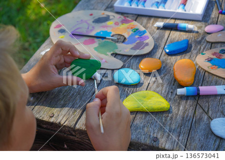 Children's creativity shines on stone canvases, resulting in charming, personal DIY gifts to make someone smile. 136573041