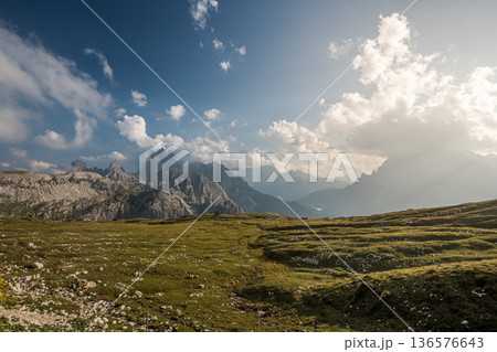 Sunset landscape of the Dolomites near Tre Cime with alpine meadows and dramatic peaks Sunset landscape of the Dolomites near Tre Cime with alpine meadows and dramatic peaks 136576643