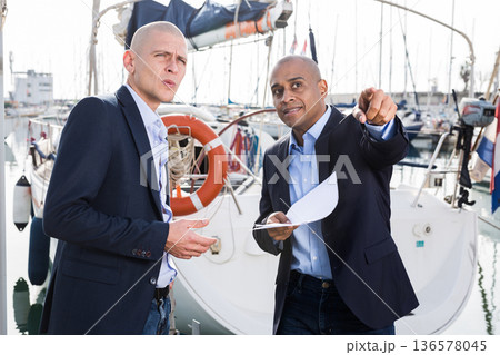 men in suits buy and sell a yacht in the seaport men in suits buy and sell a yacht in the seaport 136578045