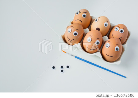 Six funny handmade Easter emoji eggs on a stand on white background close up. Christian Easter tradition, creative handmade holiday ideas for kids Six funny handmade Easter emoji eggs on a stand on white background close up. Christian Easter tradition, creative handmade holiday ideas for kids 136578506