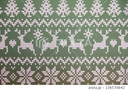 Green knitted pattern with reindeer and snowflakes in nordic style Green knitted pattern with reindeer and snowflakes in nordic style 136578642