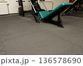 Empty gym interior with exercise equipment and puzzle mats 136578690