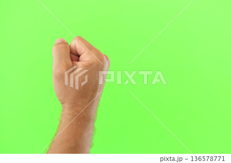 Male Hand Making Rise Up Sign Symbol. Chroma Key Green Screen Background. Gesture Movement. Body Language. 4K Footage. Close Up. Raised Hand. Clenched Closed Fist. Raised Up. Human Equal Rights. Vote Male Hand Making Rise Up Sign Symbol. Chroma Key Green Screen Background. Gesture Movement. Body Language. 4K Footage. Close Up. Raised Hand. Clenched Closed Fist. Raised Up. Human Equal Rights. Vote 136578771