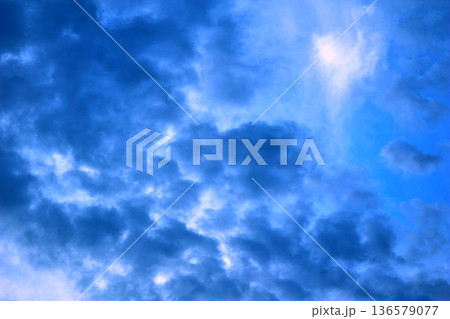 Windy stormy sky with thunderclouds and light gaps Windy stormy sky with thunderclouds and light gaps 136579077