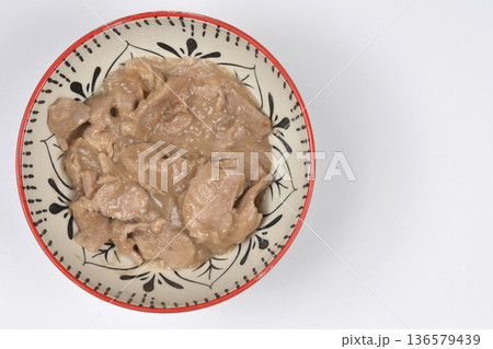 Pork in sauce in a ceramic bowl Pork in sauce in a ceramic bowl 136579439