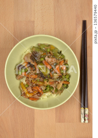 Asian dish with pork and vegetables in a bowl 136579440