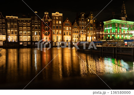 Amsterdam city at night. Old water canal houses in Netherlands Amsterdam city at night. Old water canal houses in Netherlands 136580000