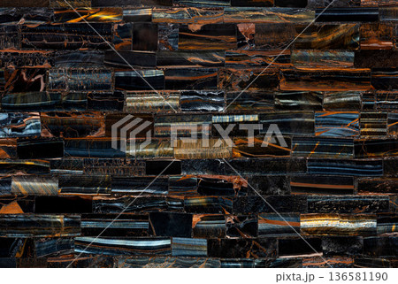 Tiger Eye Blue slab. Polished semiprecious stone for ceramic wall and floor digital tiles. Exclusive luxury gemstone background. Material for unique interior, exterior design decoration. Tiger Eye Blue slab. Polished semiprecious stone for ceramic wall and floor digital tiles. Exclusive luxury gemstone background. Material for unique interior, exterior design decoration. 136581190
