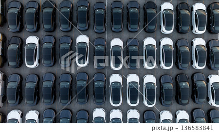 Aerial view car for sale stock lot row, Cars dealership inventory distribution automobile and automotive business, New cars parking for sale automobile automotive industry business. 136583841