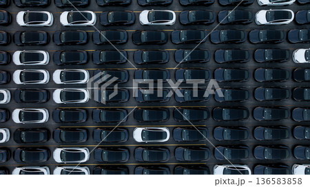Aerial view car for sale stock lot row, Cars dealership inventory distribution automobile and automotive business, New cars parking for sale automobile automotive industry business. 136583858