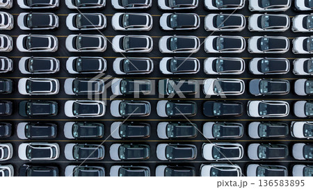 Aerial view car for sale stock lot row, Cars dealership inventory distribution automobile and automotive business, New cars parking for sale automobile automotive industry business. 136583895