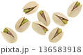 Falling pistachios isolated on white background with clipping path, full depth of field 136583918