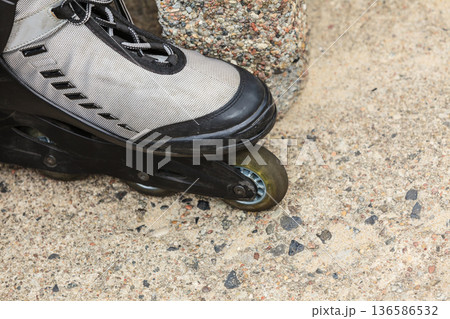 Closeup of roller skates outdoor. Closeup of roller skates outdoor. 136586532