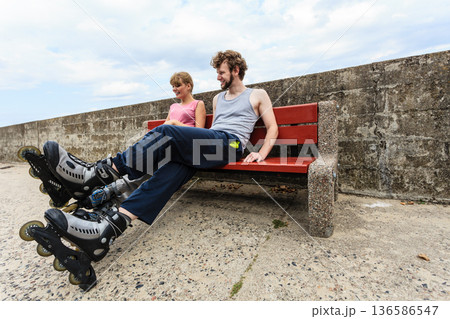 Young people friends relaxing on bench. 136586547