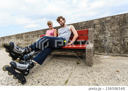 Young people friends relaxing on bench. 136586548