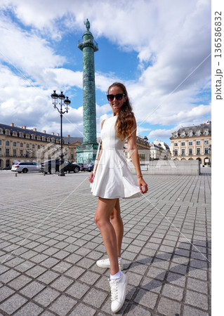 Young woman posing stylishly at Place Vendome Young woman posing stylishly at Place Vendome 136586832