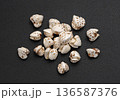 Puffed buckwheat pile isolated on black background, cereal breakfast grains, top view, full depth of field 136587376