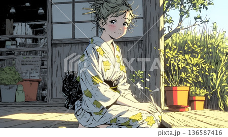 浴衣姿で夕涼みをしている若い女性