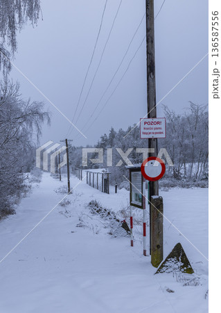 Winter landscape with border crossing sign in Czechia Winter landscape with border crossing sign in Czechia 136587556