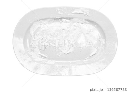 White wheat flour scattered on a ceramic plate isolated on white background. White wheat flour scattered on a ceramic plate isolated on white background. 136587788