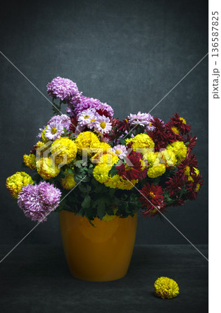 Still life with a bouquet of chrysanthemums in a vase 136587825