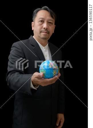 Man Holding Earth Globe Symbolizing Sustainability and Global Responsibility Man Holding Earth Globe Symbolizing Sustainability and Global Responsibility 136590117