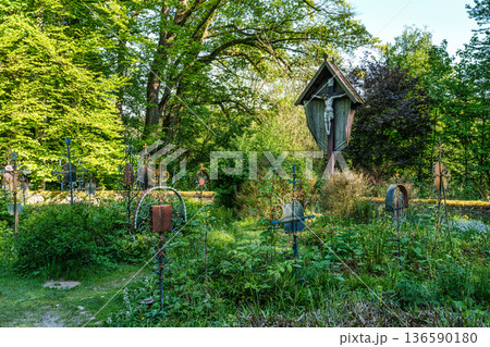 Church St.Clemens in Kranzberg with ancient graveyard and old wr 136590180