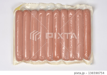 Vacuum sealed sausages on white background 136590754