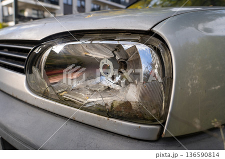 Broken Car Headlight Close Up Broken Car Headlight Close Up 136590814