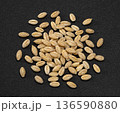 Barley grain pile on dark background, natural whole cereal ingredient, full depth of field, top view 136590880