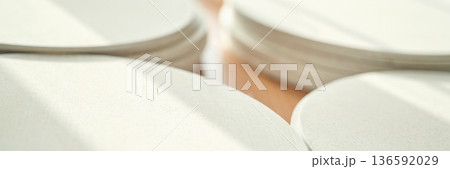 Close-up of smooth beige circular shapes in soft natural light abstract 136592029