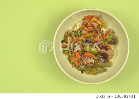 Asian dish with pork and vegetables on green background Asian dish with pork and vegetables on green background 136592431