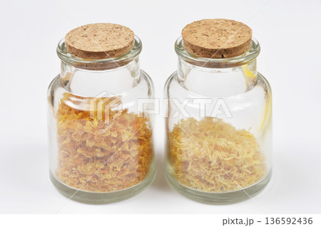 Dried orange and lemon peel in glass jars 136592436