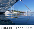 View from the sea of moored yachts and sailboats on the coast of Atherinos Bay, Meganisi island, Ionian Sea, Greece in the summer. Selective focus. Horizontal. 136592770