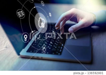 Technology and cloud computing used in office setting with laptop, displaying graphics Technology and cloud computing used in office setting with laptop, displaying graphics 136592801