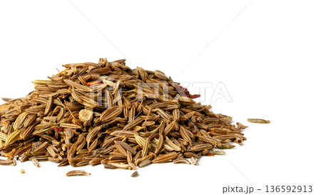 Cumin seeds arranged in a pile on a white background for cooking and seasoning 136592913