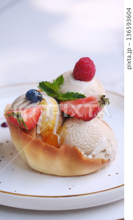 Homemade strawberry vanilla ice cream with fresh strawberries. Sweet berry summer dessert. Homemade strawberry vanilla ice cream with fresh strawberries. Sweet berry summer dessert. 136593604