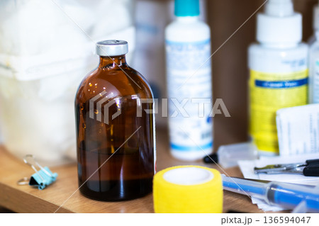 Medical supplies overview. Sterile medical materials arranged on cluttered healthcare workspace 136594047