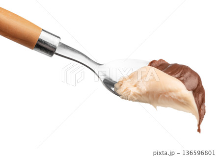 Chocolate and White Cream on Spoon Isolated 136596801