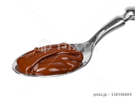 Creamy Chocolate Spread Texture on Spoon Isolated 136596804