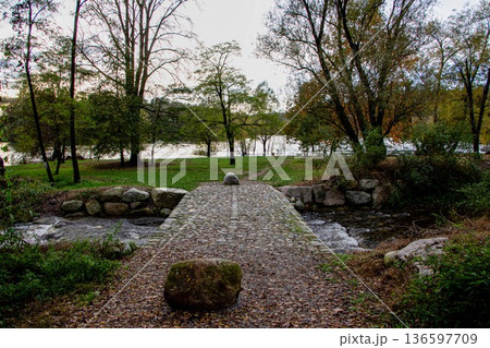 Small Stone Bridge Along the Banks of the Ticino 136597709