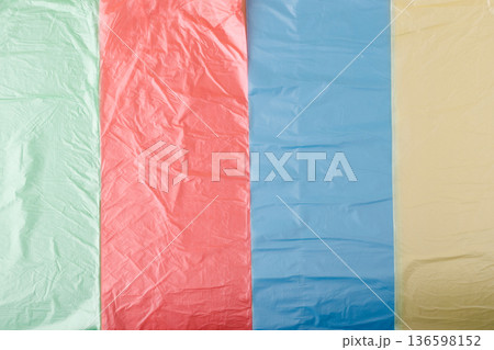 Colorful plastic bags creating an abstract textured background 136598152