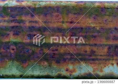 Close-up of weathered rusty metal with textured surface and patterns Close-up of weathered rusty metal with textured surface and patterns 136600887