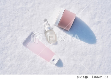 Skincare products for winter hydration in snow 136604083