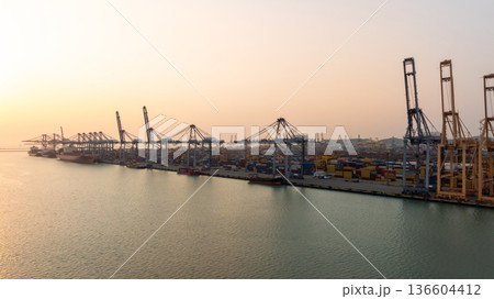 Aerial view Container cargo ship loading unloading container import export sea port, Global trade business container cargo ship freight shipping commercial trade logistic transportation international. Aerial view Container cargo ship loading unloading container import export sea port, Global trade business container cargo ship freight shipping commercial trade logistic transportation international. 136604412