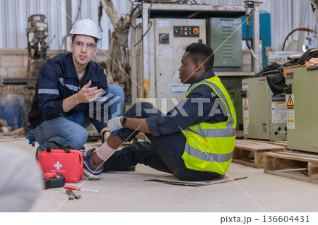 First aid support accident at work of worker at factory.  136604431
