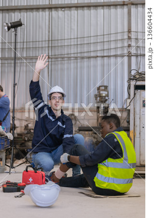 First aid support accident at work of worker at factory.  136604434